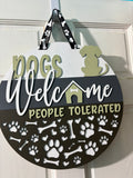 Door Hanger Dogs Welcome People Tolerated in light and dark greens 16 inch
