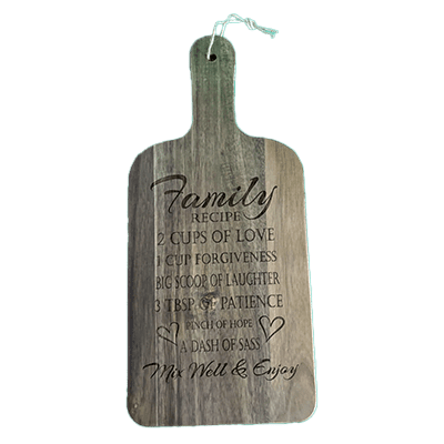 A wooden bottle shaped plaque with the words family, home and a cup of love.