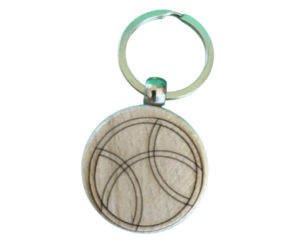 A wooden key chain with a basketball design.