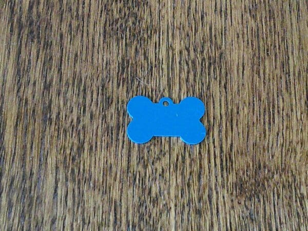 A blue piece of paper on top of wood.