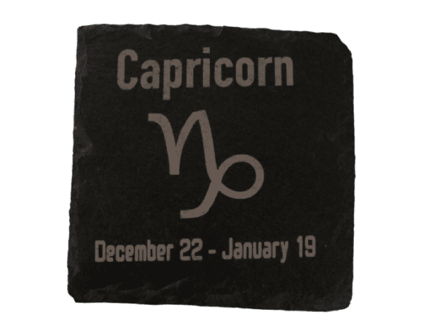 A square stone with the capricorn symbol on it.