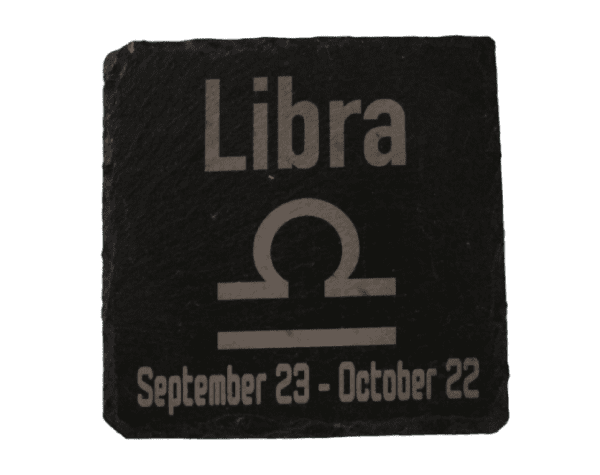 A stone tile with the zodiac sign for libra.