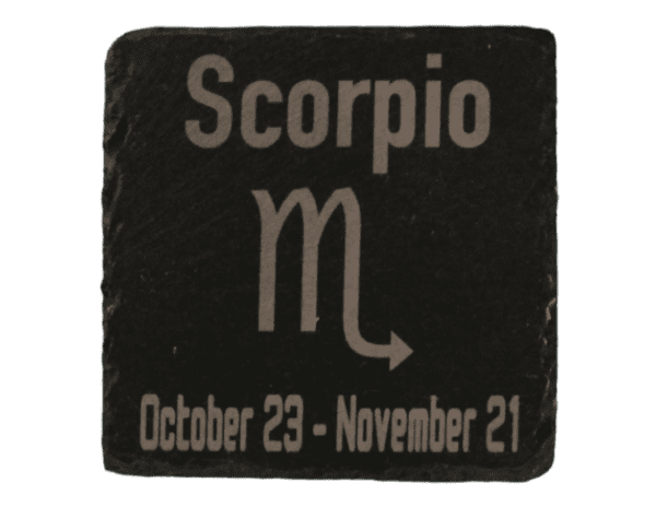 A stone with the zodiac sign scorpio written on it.