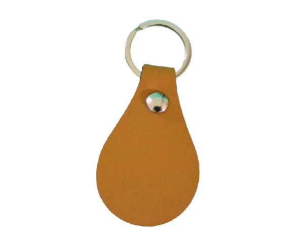 A brown leather key chain with a metal ring.