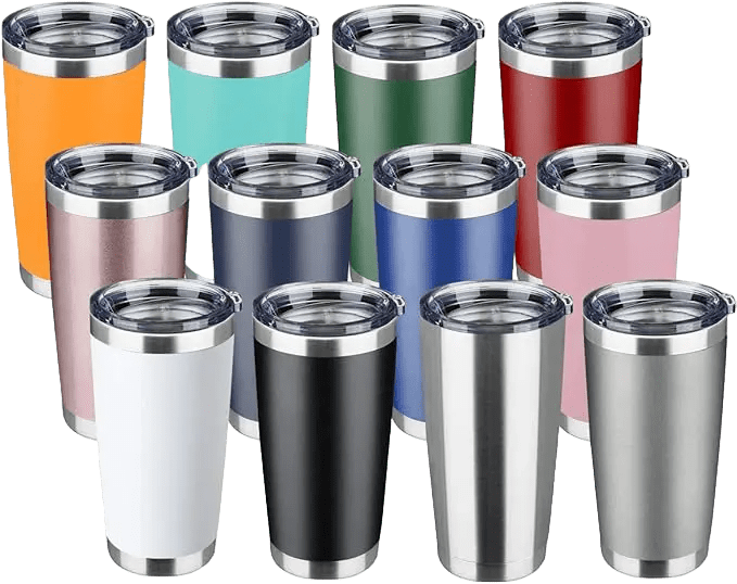 A group of different colored cups on top of a green background.