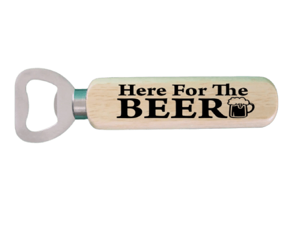 A wooden bottle opener with the words " here for the beer ".