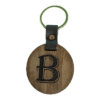 A wooden key chain with the letter b on it.