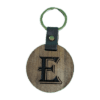 A wooden key chain with the letter e on it.