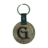 A wooden key chain with the letter g on it.