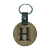 A wooden key chain with the letter h on it.