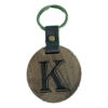 A wooden key chain with the letter k on it.