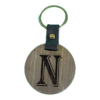 A wooden key chain with the letter n engraved on it.