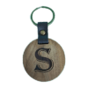 A wooden key chain with the letter s on it.