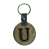 A wooden key chain with the letter u on it.