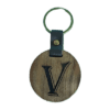 A wooden key chain with the letter v on it.