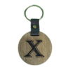 A wooden key chain with the letter x on it.